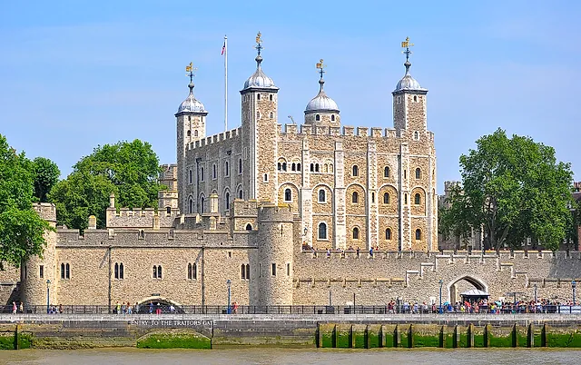 The Tower of London seen from the River Thames, with the riverside walls and towers in front of the White Tower